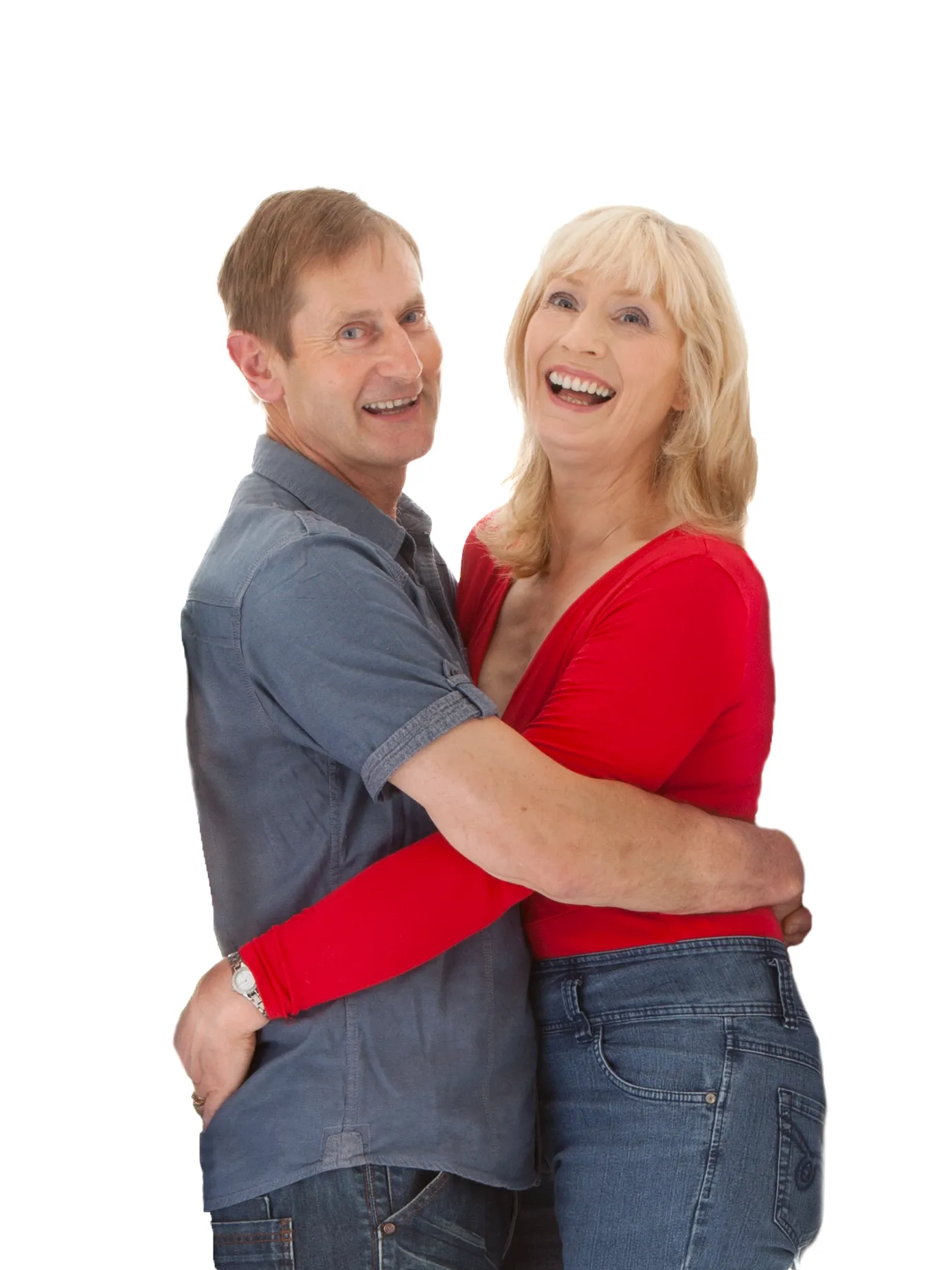 A middle-aged man and woman stand close together, smiling and laughing, against a plain white background. Andy Boyle Photography